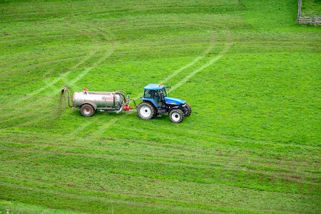 tractor fertilizing the grass